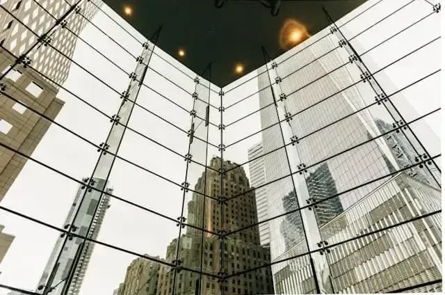 Glass skyscraper buildings symbolizing financial institutions and regulatory oversight entering the stablecoin and crypto ecosystem.